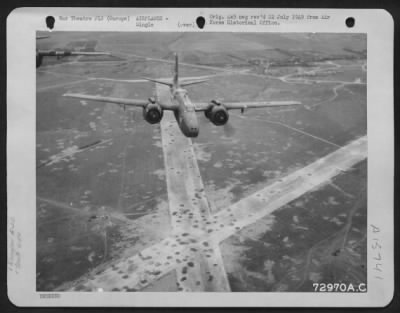 Thumbnail for Consolidated > Douglas A-20S Of The 410Th Bomb Group Returning From A Bombing Mission, Fly Over A Pockmarked Airfield Somewhere In Europe.