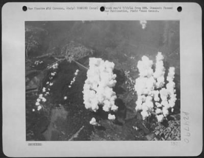 Thumbnail for Consolidated > White Smoke Rises From A German Emplacement At Arezzo, In Central Italy, As Bombs From Attacking Martin B-26 Marauders Of The First Tactical Air Force, Hit The Target Area.  The Closely Concentrated Pattern Of Bombs Gives An Idea Of The Accuracy Of The Ma