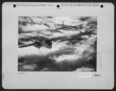 Consolidated > Two North American B-25 'Mitchells' Wing Their Way Above A Carpet Of Clouds Enroute To Bomb Enemy Installatioin Sonewhere In Europe.