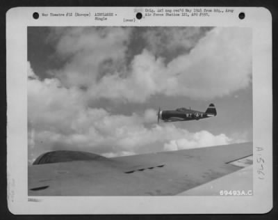 Thumbnail for Consolidated > A Republic P-47 Thunderbolt Is Seen Off The Starboard Wing Of A Boeing B-17 "Flying Fortress" Of The 91St Bomb Group, Participating In A Fighter Escort Mission Over Enemy Territory Somewhere In Europe.  10 June 1943.