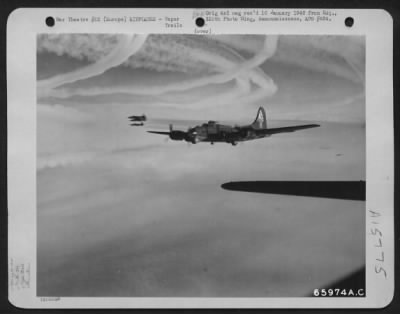 Consolidated > Against A Background Of Vapor Trails Left By Preceding Heavy Bombers, A Formation Of 381St Bomb Group Boeing B-17 Flying Fortresses Heads For The Target, Somewhere In Europe.