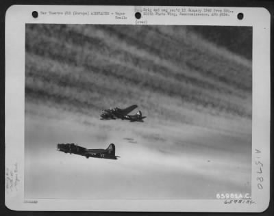 Thumbnail for Consolidated > Boeing B-17 Flying Fortresses Of The 381St Bomb Group En Route To Bomb Enemy Installations In Europe, Are Photographed Against A Backdrop Of Vapor Trails.