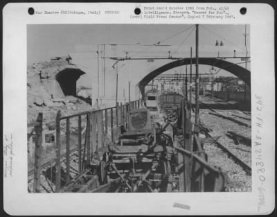 Consolidated > This Po River Target Was The Rail Yards At Bologna, Italy, Attacked By Planes Of The Mediterranean Allied Air Forces.  An Arch Of The Mascarella Footbridge Was Destroyed, And A Line Of Railroad Cars Loaded With German Equipment Burned And Wrecked.