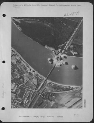 Thumbnail for Consolidated > Consolidated B-24 Liberator Bombers Of The 15Th Af Precision Bombed The Baja Railroad Bridge On Sept. 17 1944.  Photo Shows A Direct Hit On The Bridge.  Italy.