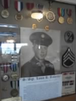 Framed display of dad with his medals