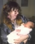 Thumbnail for Mom Holding 1st Grandchild, my son