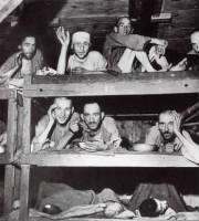 BuchenwaldSurvivorsEatInBunks.jpg