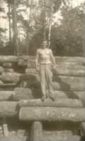 Dad with pose on logs.jpg