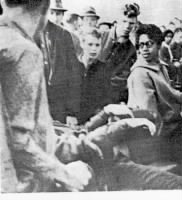 Maxine Walker Looks Askance as Paul Laprad is Pulled off his seat at lunch counter sit in 1960