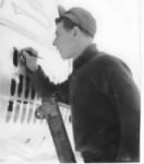 T/Sgt Fred Lawrence, CREW CHIEF, Painting BOMBS (Missions) on his Ship./ Corsica