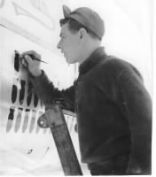 Fred painting the Mission Tally on the B-25 BOMBER