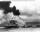 8_USS Maryland and Capsized USS Oklahoma_07Dec1941.jpg