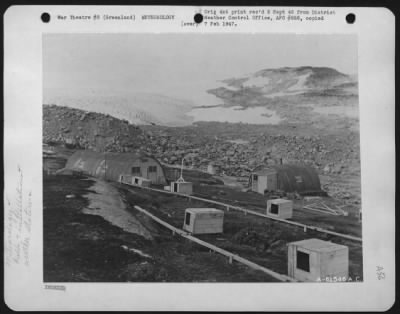 General > View Of Cape Adelaer, Greenland.  Warehouse On The Left And On The Right Is Rescue House Of 1943-1944 Bicd Installation.  In The Foreground May Be Seen Doghouses.  Water For Camp Is Normally Obtained From Stream Running To Right Of Rescue House.  The Stre