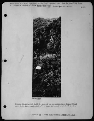 General > Wrecked Consolidated B-24D is spotted on mountainside on Cocos Island near Costa Rica, Central America, where it burned a patch of jungle.