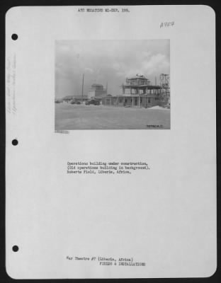 Thumbnail for General > Operations Building Under Construction.  (Old Operations Building In Background).  Roberts Field, Liberia, Africa.