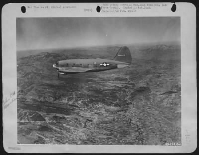 Thumbnail for Curtiss > Over the mountains of western China, a Curtiss C-46 Commando approaches its destination on a route flown by the India China Div., ATC. In January, 1945, this division put more than 44,000 tons of freight into old Cathay by air.