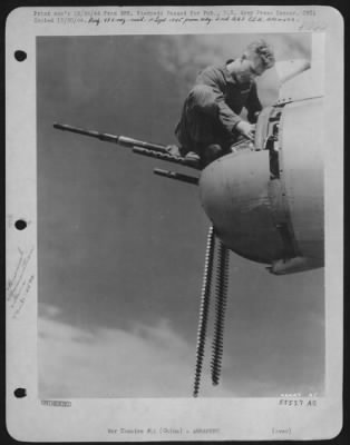 General > S/Sgt. Lawrence D. Sand, Boeing B-29 Superfortress gunner from Emerado, North Dakota, loads his .50 cal., tail machine guns prior to a 20th Bomber Command mission against Japan. CHINA. 444th Bomb Group.