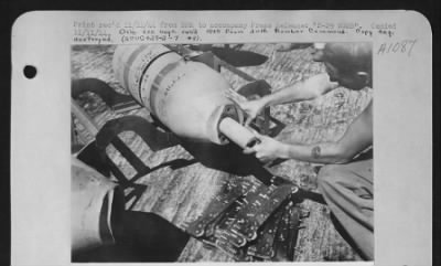 General > Sgt William N. Bottom, Uniontown, Pa., inserts an igniter into a 500-lb demolition bomb which will be dropped by a B-29 of the U.S. Army 20th Air force. After this is inserted, a bursting charge is placed into the bomb. Lower photo shows