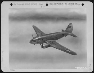 Thumbnail for Curtiss > A Curtiss C-46 In Flight Near Kunming, China.  5 June 1945