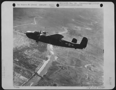 North American > A North American B-25 "Mitchell" Bomber Is Shown In Flight Over China On March 11, 1945, When Planes Of The 22Nd Bombardment Group, 2Nd Bombardment Squadron, 5Th Air Force, Bombed The Railroad Bridge At Changtuikwan.