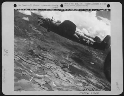 North American > A North American B-25 "Mitchell" Bomber Of The 341St Bombardment Group, 22Nd Bombardment Squadron, 14Th Air Force, Is Shown In Flight Over China During A Bombing Mission On Mangshih On Sept. 29,1944.