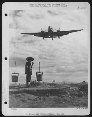 Curtiss > Off On Another Cargo Carrying Mission From A Base Somewhere In China, A Curtiss C-46 Roars Over The Head Of A Chinese Coolie.