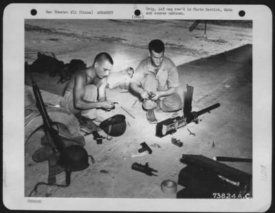 General > Armorers Work On A Gun Prior To Installing It In A Boeing B-29 "Superfortress" At An Air Base In China.