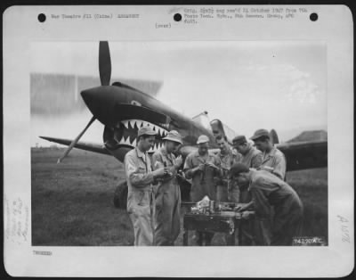 General > Armorers Of The 16Th Fighter Squadron, 51St Fighter Group, Assemble Guns For A Curtiss P-40 At Peishihwa, China, 21 October 1942.  They Are, Left To Right: S/Sgt. P. Koerner, Hagerstown, Maryland; Sgt. Allen Russell, Kansas City, Missouri; Sgt. R.L. Hake,