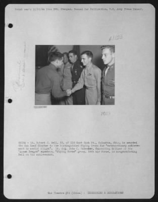 Awards > China - Lt. Robert J. Bell, 23, Of 115 East Rich St., Columbus, Ohio, Is Awarded The Oak Leaf Cluster To The Distinguished Flying Cross For 'Extraordinary Achievement In Aerial Flight'.  Lt. Colonel John C. Habecker, Commanding Officer Of The 'Assam Drago