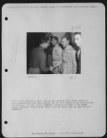 China - Capt. William M. Pagle, 24, Of 1321 Caldwell Ave., Fliny, Mich., Is Being Congratulated Upon Being Awarded The Oak Leaf Cluster To The Distinguished Flying Cross.  Lt. Colonel John C. Habeck, Commanding Officer Of The 'Assam Dragon' Squadron, 'Fly - Page 1