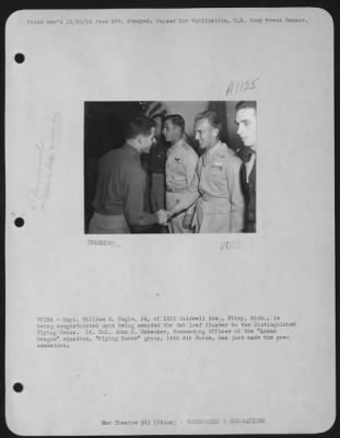 Awards > China - Capt. William M. Pagle, 24, Of 1321 Caldwell Ave., Fliny, Mich., Is Being Congratulated Upon Being Awarded The Oak Leaf Cluster To The Distinguished Flying Cross.  Lt. Colonel John C. Habeck, Commanding Officer Of The 'Assam Dragon' Squadron, 'Fly