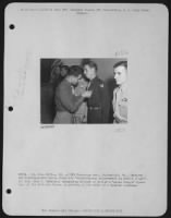 China - Lt. Otto Miller, 23, Of 318 Chatauqua Ave., Portsmouth, Va., Receives The Distinguished Flying Cross For 'Extraordinary Achievement In Aerial Flight'.  Lt. Colonel John C. Habeck, Commanding Officer Of The 'Assam Dragon' Squadron, 'Flying Horse' G - Page 1