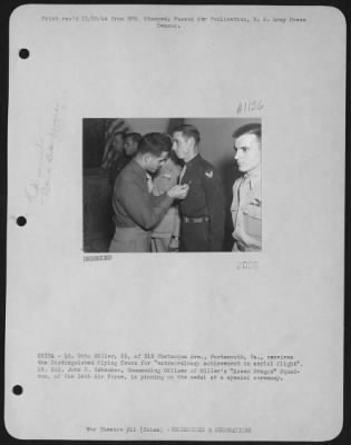 Awards > China - Lt. Otto Miller, 23, Of 318 Chatauqua Ave., Portsmouth, Va., Receives The Distinguished Flying Cross For 'Extraordinary Achievement In Aerial Flight'.  Lt. Colonel John C. Habeck, Commanding Officer Of The 'Assam Dragon' Squadron, 'Flying Horse' G