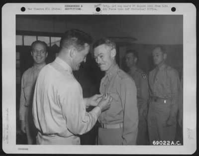 Thumbnail for Awards > Brig. General Edgar E. Glenn Is Presented The Air Medal By Major General Claire L. Chennault, Commanding General Of The 14Th Air Force, At A Base Somewhere In China.  Colonel John O. Neal (Left) Looks On Approvingly.  14 August 1944.