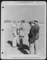 Thumbnail for Major General Claire L. Chennault Presents An Award To A Member [Sgt. Beard] Of The 14Th Air Force During A Ceremony At An Air Base In China.  [2Nd From Right, Capt. Robert A. Wiadner; Right Colonel Clinton D. Vincent.] - Page 13