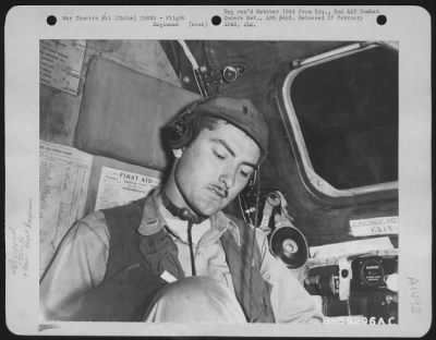 Engineer > 2Nd Lt. George H. Williamson Of Carthage, Texas, Flight Engineer On A Boeing B-29 Of The 45Th Bomb Squadron, 40Th Bomb Group, At His Position On The Boeing B-29 'Eddie Allen'.  China.