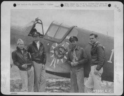 Fighter > Former Members Of The American Volunteer Group, Serving With The 23Rd Fighter Group, Stand Beside A Curtiss P-40 With The Insignia Of The Group, China. They Are, Left To Right: Major John R. Alison Of Gainsville, Florida; Major David Hill Of Hunt, Texas;