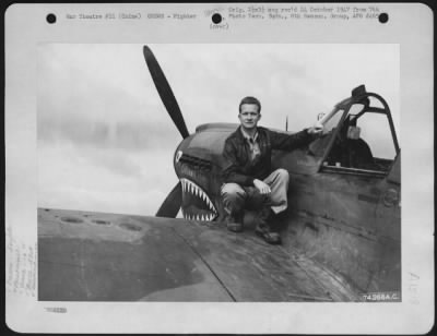 Fighter > Lt. L.H. Couch (Monroe, North Carolina) Of The 16Th Fighter Squadron, 51St Fighter Group, Seated On The Wing Of His Curtiss P-40 "Lillian" At Peishihwa, China.  22 October 1942.