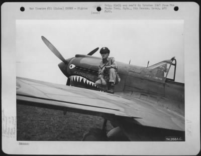 Fighter > Lt. R.E. Smith, Cincinnati, Ohio, Of The 16Th Fighter Squadron, 51St Fighter Group, Poses On The Wing Of His Curtiss P-40 "Katydid" At Peishihwa, China.  20 October 1942.