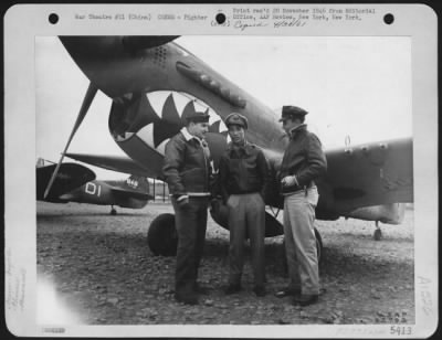 Fighter > Colonel T. Alan Bennett And Major C.H. Yaun, Group Commanding Officers Of A Fighter Group Of The Chinese American Composite Wing, And Major W.L. Turner Discuss Operations While Standing By A Curtiss P-40 At An Air Base Somewhere In China.