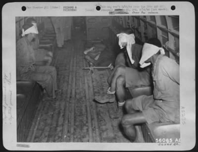 Thumbnail for General > four Chinese prisoners (blindfolded) one Jap prisoner on stretcher. These prisoners were flown in on a Douglas C-47 from Shingbwiyang.-They had been captured by Chinese troops. CHINA.