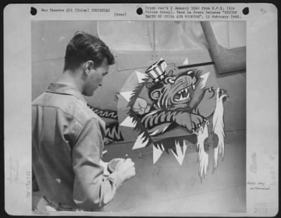 General > Insignia Of The China Air Task Force Fighter Command Is Being Painted On A Plane By Sargeant Larue. It Shows The Flying Tiger Of The American Volunteer Group Now Wearing Uncle Sam'S Hat To Show He Is Fighting For The United States Army Air Force. The Chin