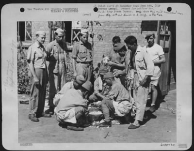 Thumbnail for General > Allied Prisoners Of War At Mukden, Manchuria, Very Seldom Had The Job Of Slicing Cabbage Because Maize And Water Was Their Principal Menu For Three Years.  Watching The Japs (Former Guards Of The Prisoners) Slice Cabbage Are (Left To Right) Col R.G. Roger