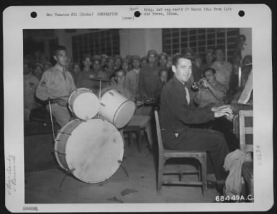 General > 1St Lt. Addison Bailey, Who Formerly Played The Piano At Leon And Eddie'S In New York, Is Pictured Here "Pounding The Ivorys" During A Show Presented By The Men Of The 14Th Air Force In China Under The Auspices Of Special Services.