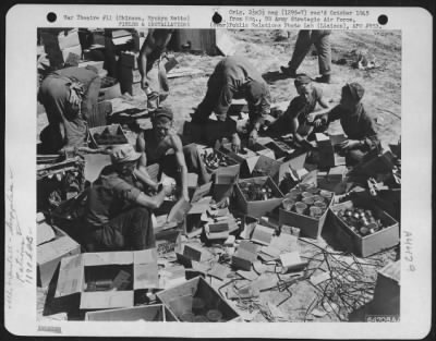 Thumbnail for Supplies > Men Of The 1878Th Engineer Aviation Battalion Open Boxes Of Rations.  Okinawa, Ryukyu Retto, May 1945.