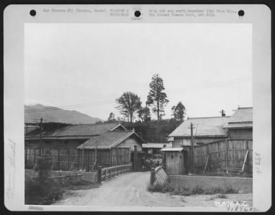 Thumbnail for General > Gate To Hanowa Prisoner Of War Camp # 6 In Honshu, Japan With Prisoners Waving In The Background.  14 September 1945.