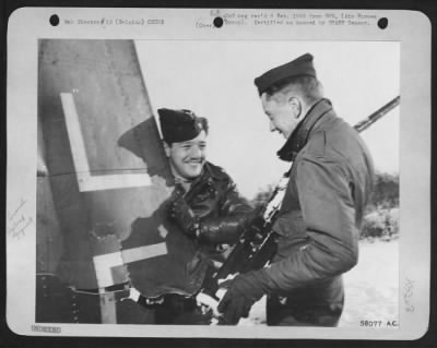 Thumbnail for General > The wing section held by 2d Lt. Melvin B. Paisley, Portland, Oregon, (left) and the cannon grasped by 2d Lt. John J. Kennedy, Galesburg, Ill., were part of a Luftwaffe plane shot down by the 9th AF pilots during an enemy air raid on their base