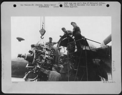 Thumbnail for Engines > The First Boeing B-29 To Land On Okinawa, Ryukyu Retto Was Forced Down When Two Of Its Engines Failed.  Here, Maintenance Men Are Shown Installing A New Engine On The Plane.  Mechanics And Equipment Were Florwn In To Repair The Plane With All Possible Spe