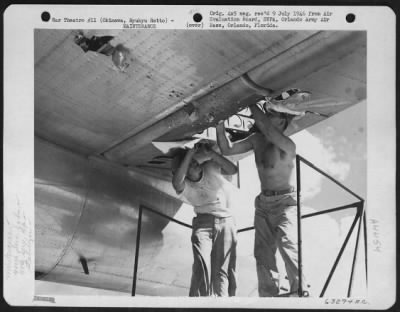 Thumbnail for General > A Couple Of Men Of The 480Th Service Sqdn, 59Th Service Group Repairing Damaged Elevator And Stabilizer Of A Boeing B-29 On Bolo Strip.  11 August 1945.