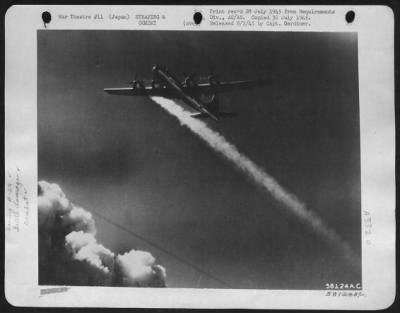 General > Boeing B-29 With One Engine On Fire Continues On Bombing Run Over Japan.